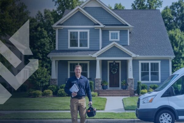 A home service professional standing in front of a residential house with a service van, illustrating the impact of private equity in home service marketing for independent contractors.