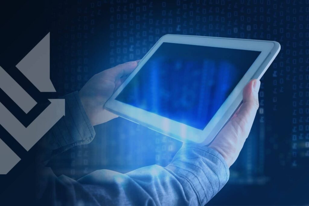 Digital tablet displaying blue light and data patterns held by a user, symbolizing the automated infrastructure and privacy shifts behind what is programmatic advertising.