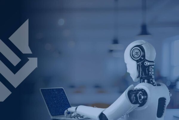 AI robot working on a laptop in an office, illustrating the question can Claude build a website for a business.