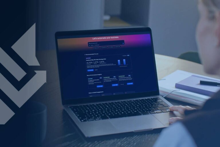A service business owner reviewing data on a laptop, evaluating software to choose the best CRM for service business operations.