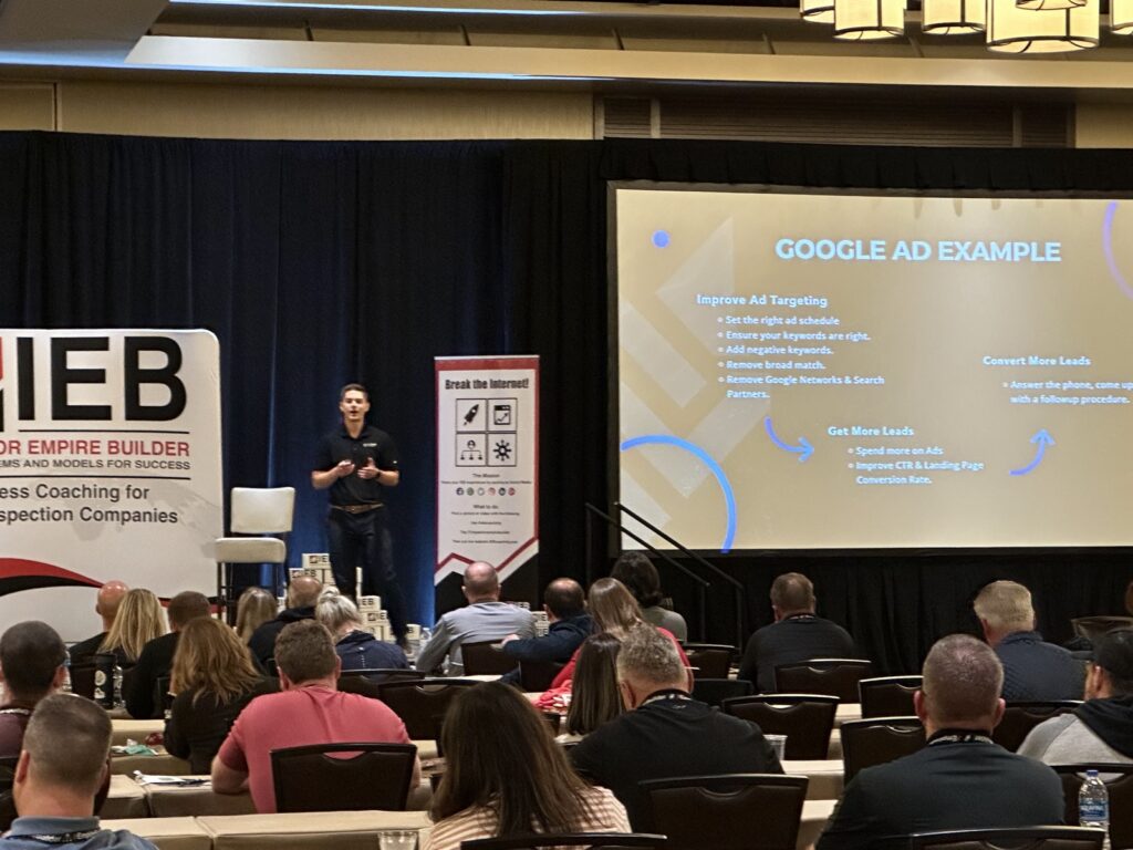 Aaron Shishilla presenting a Google Ads example to an audience at an IEB conference