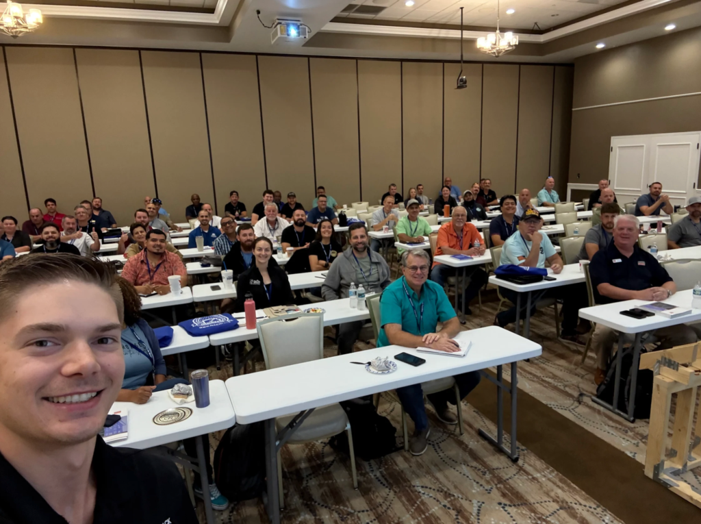 A room of home inspection business owners attending a WolfPack Advising marketing workshop