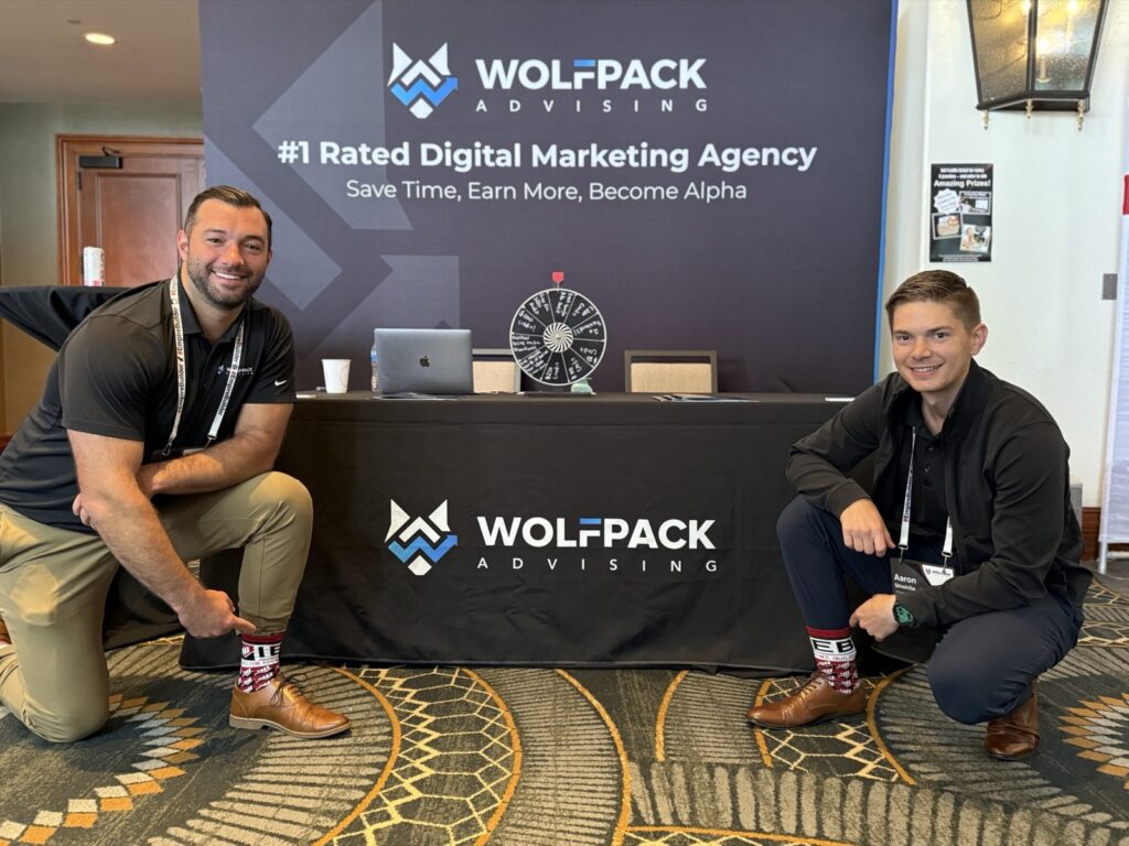 Aaron Shishilla and a teammate at the WolfPack Advising booth at an IEB conference